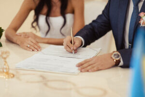 A couple signing a document